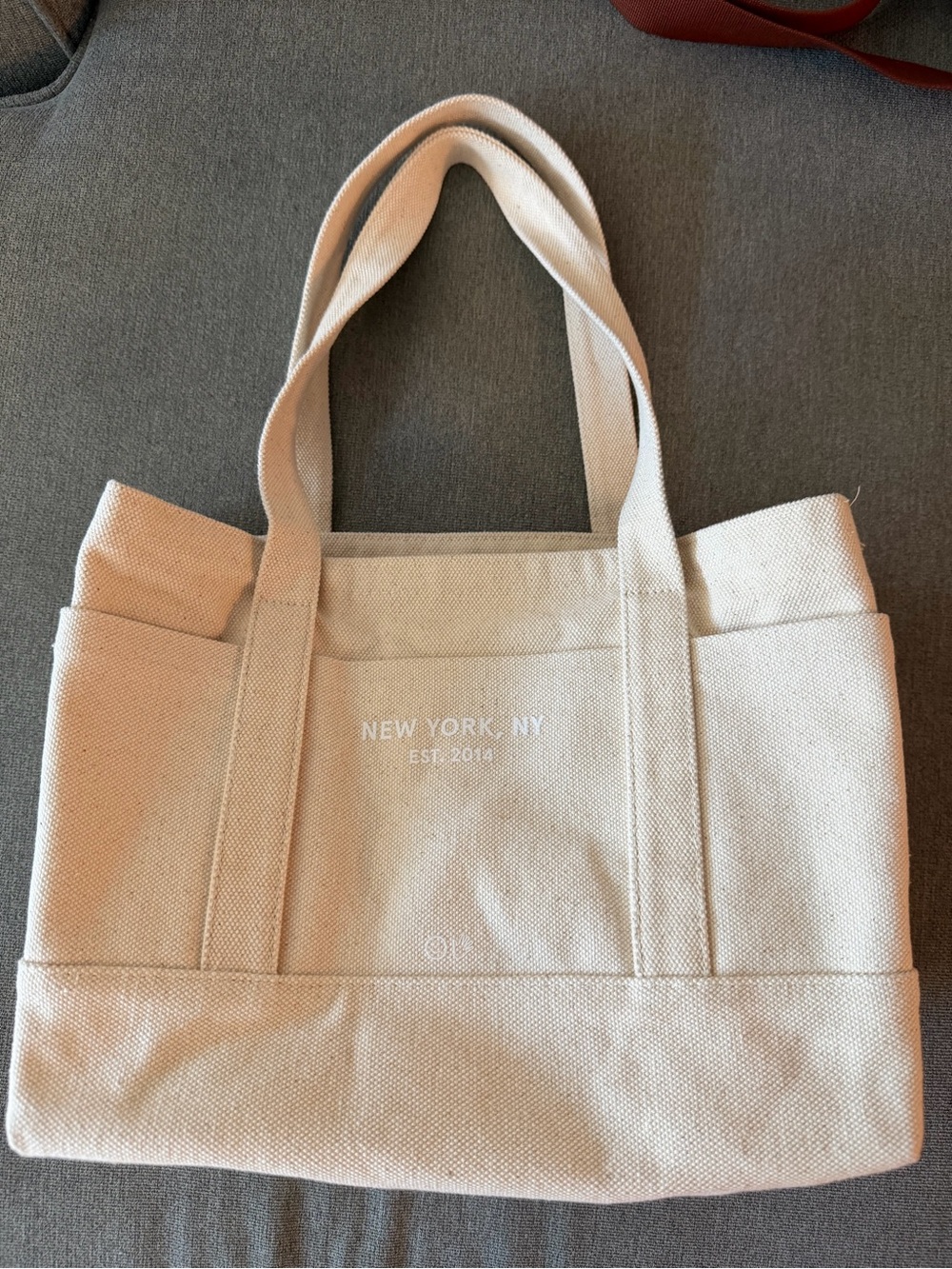 Glossier Cream Canvas Tote with Subtle White Logo - Picture 2 of 4